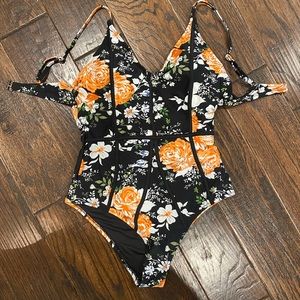 Cupshe black & orange floral one piece suit.  NWT